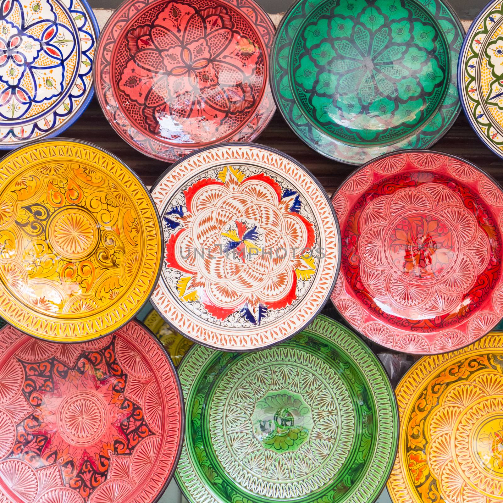 Traditional arabic handcrafted, colorful decorated plates shot at the market in Marrakesh, Morocco, Africa.