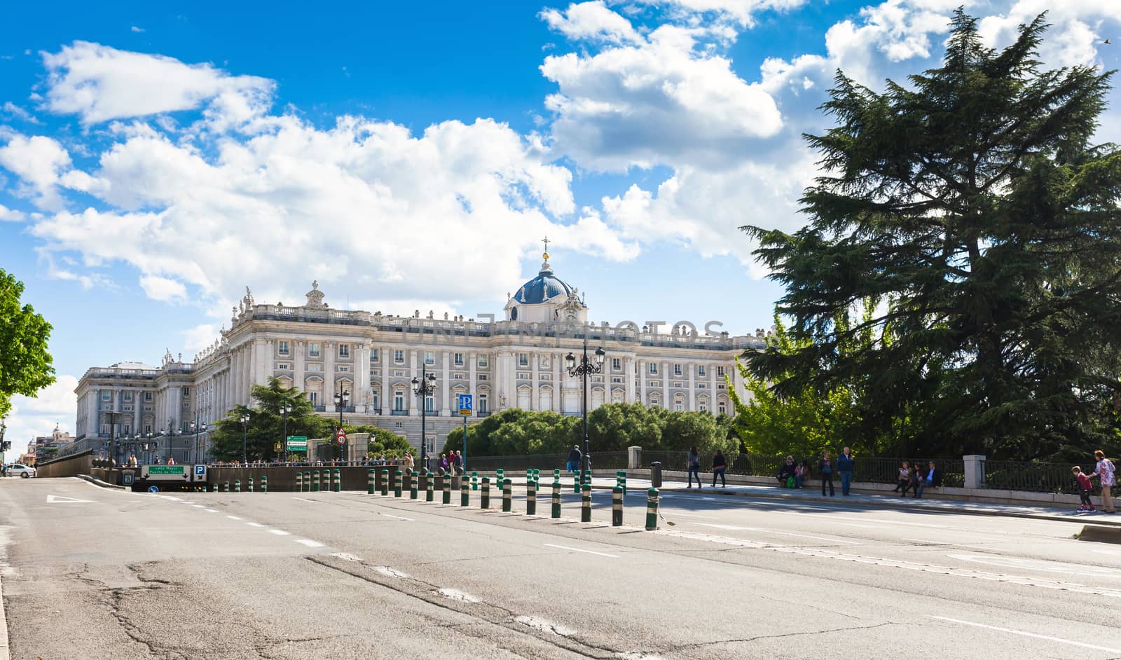 Madrid, Spain - May 6, 2012: Royal palace (Palacio Real de Madrid) with tourists on spring day in Madrid, Spain