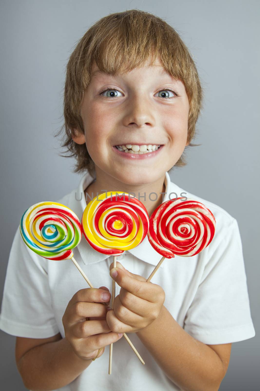 child boy eating lollipop by anelina