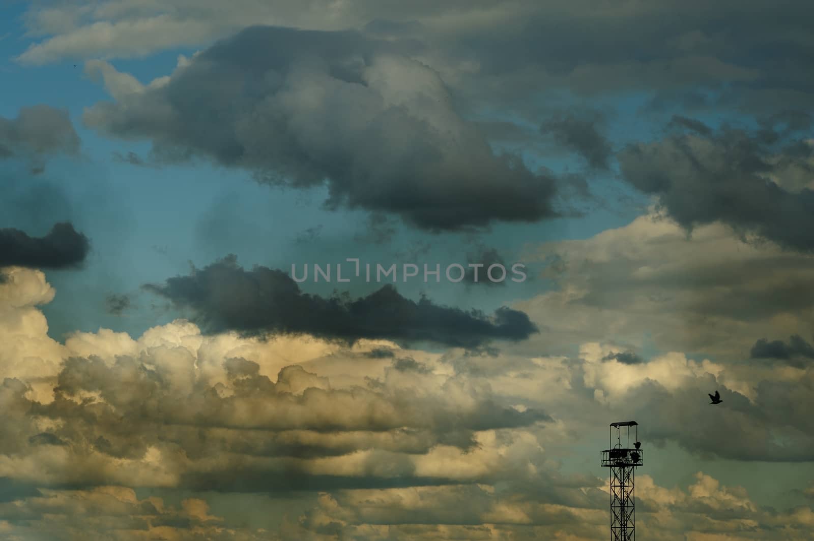 Summer cloudscape with blue sky, dirty smoke and steel tower by Borodin