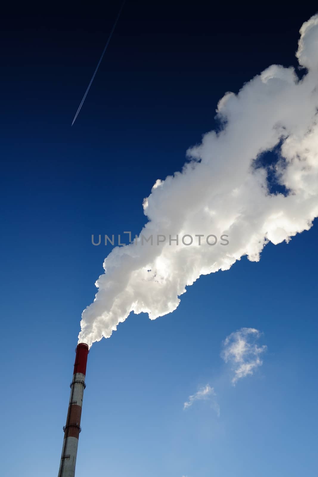Steam-heat pipe in blue sky background vertical