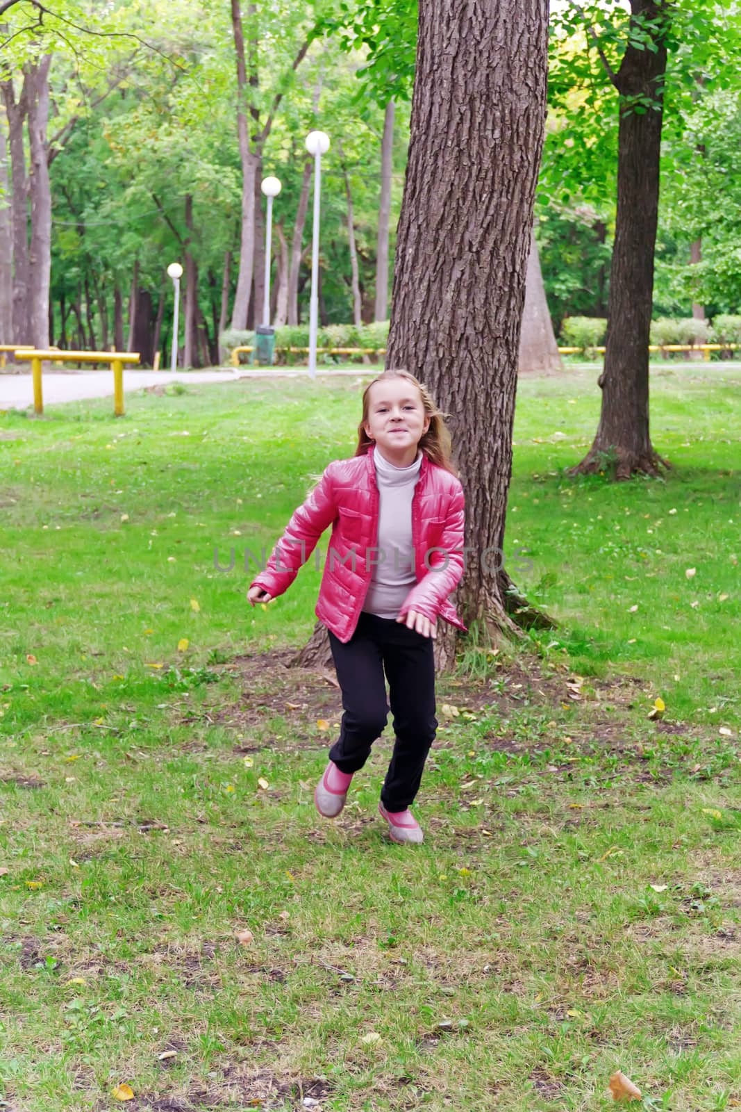 Photo of cute running girl in summer