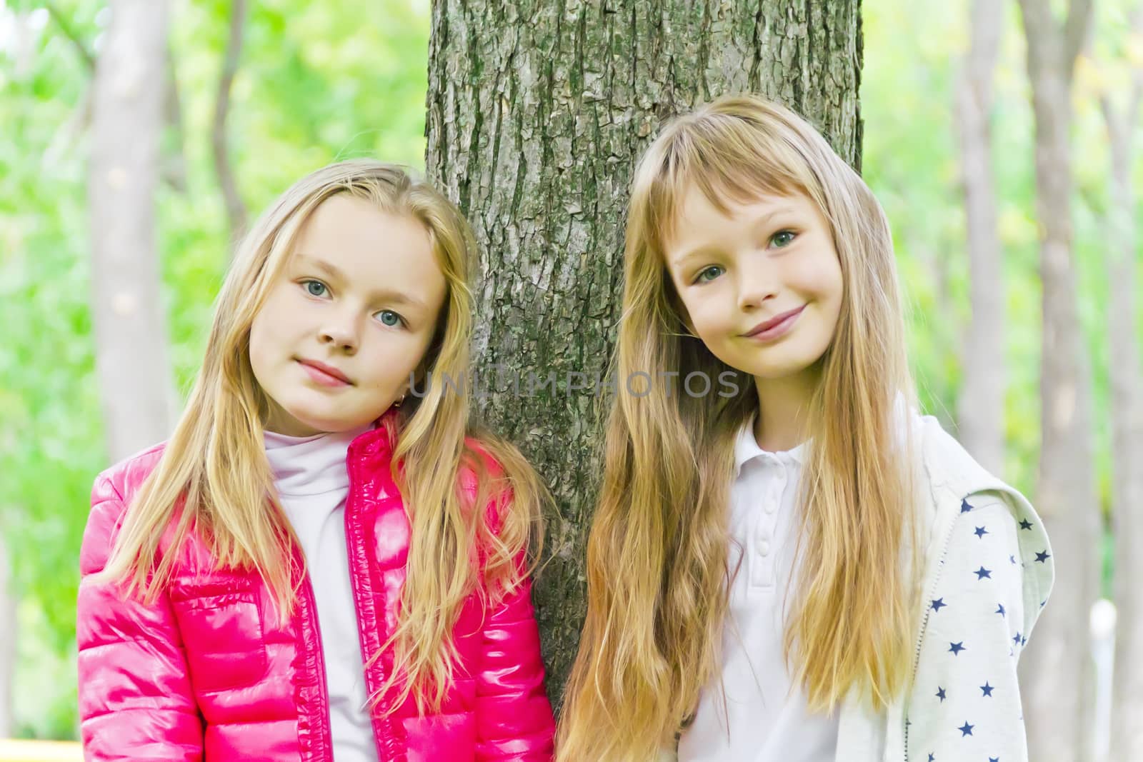 Photo of two cute girls with long hairs