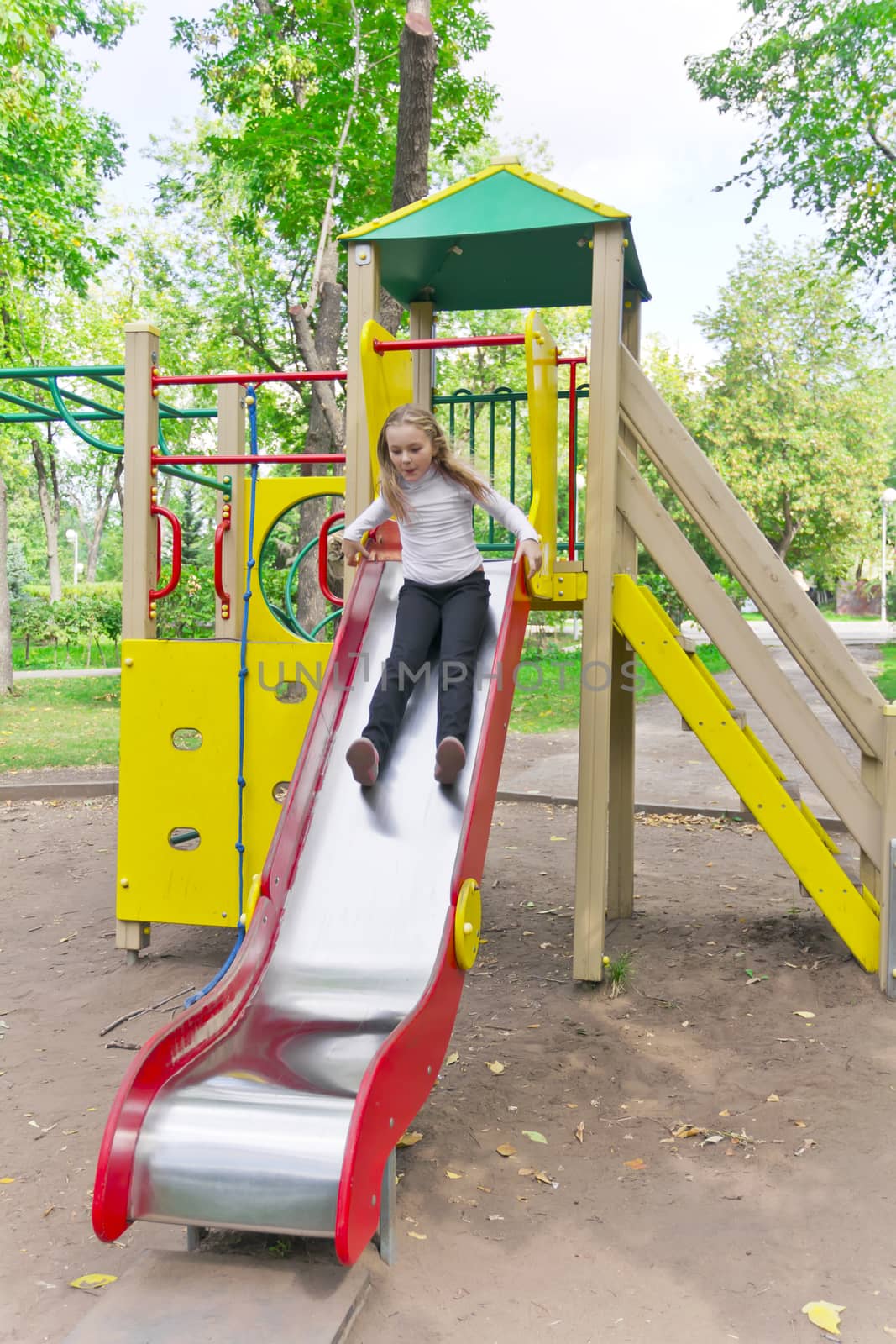 Photo of active girl on nursery platform in summer