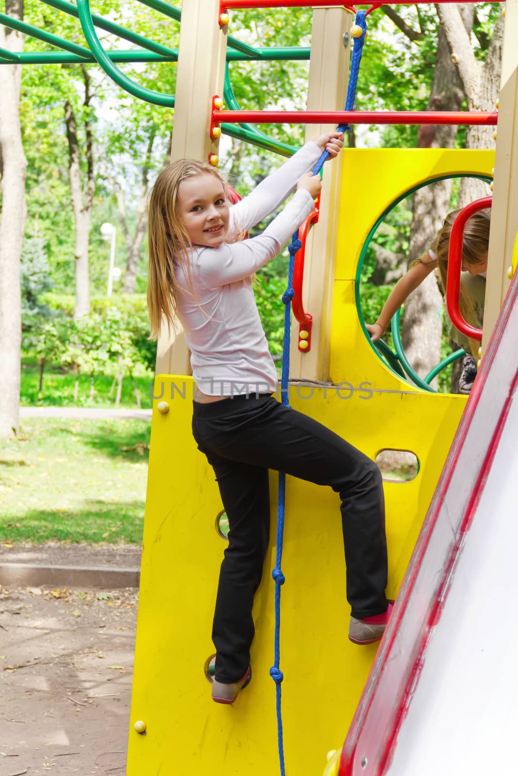 Photo of cute playing girl in summer