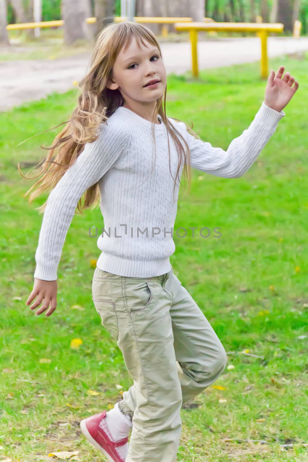 Photo of cute playing girl in summer
