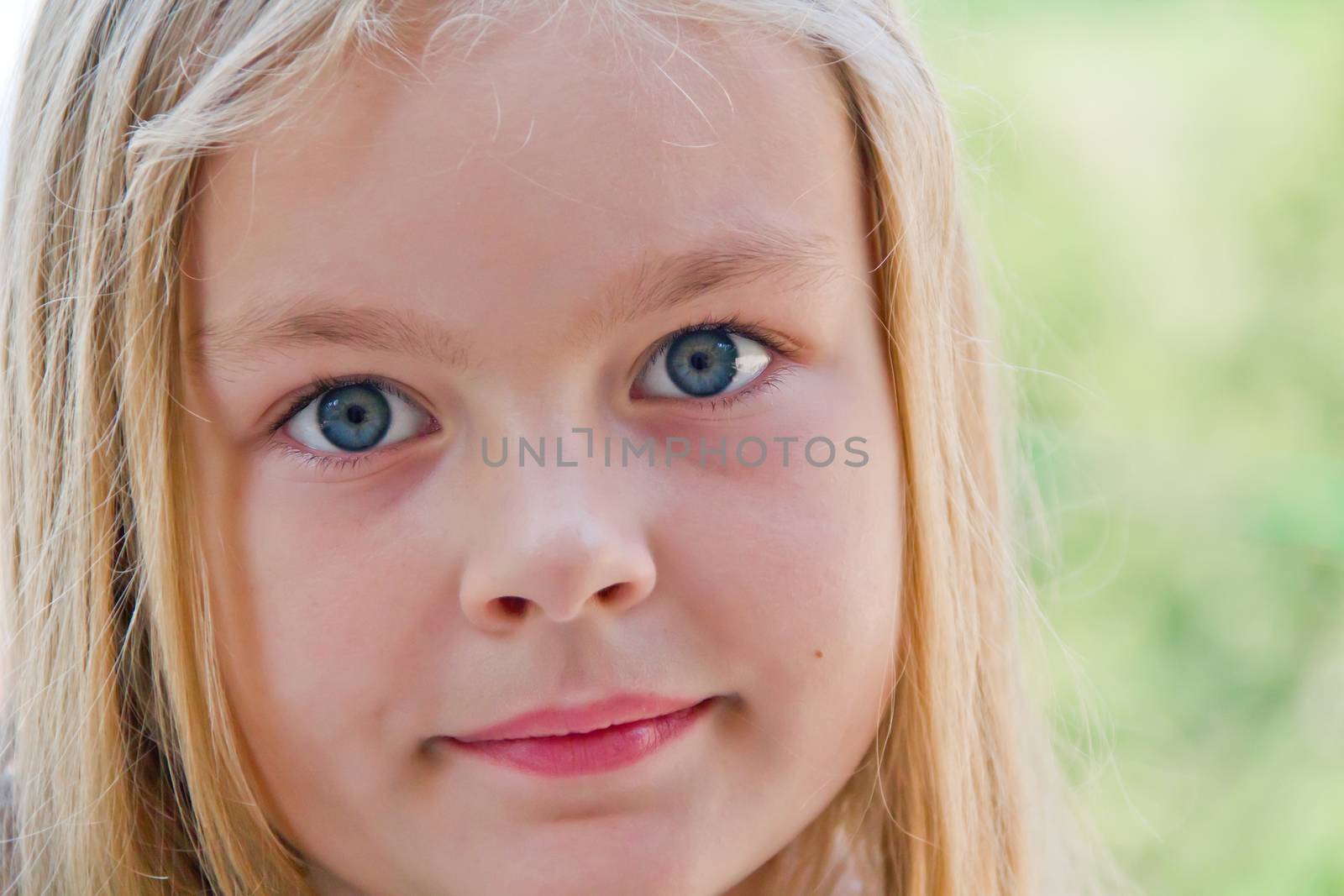 Photo of cute girl with big blue eyes
