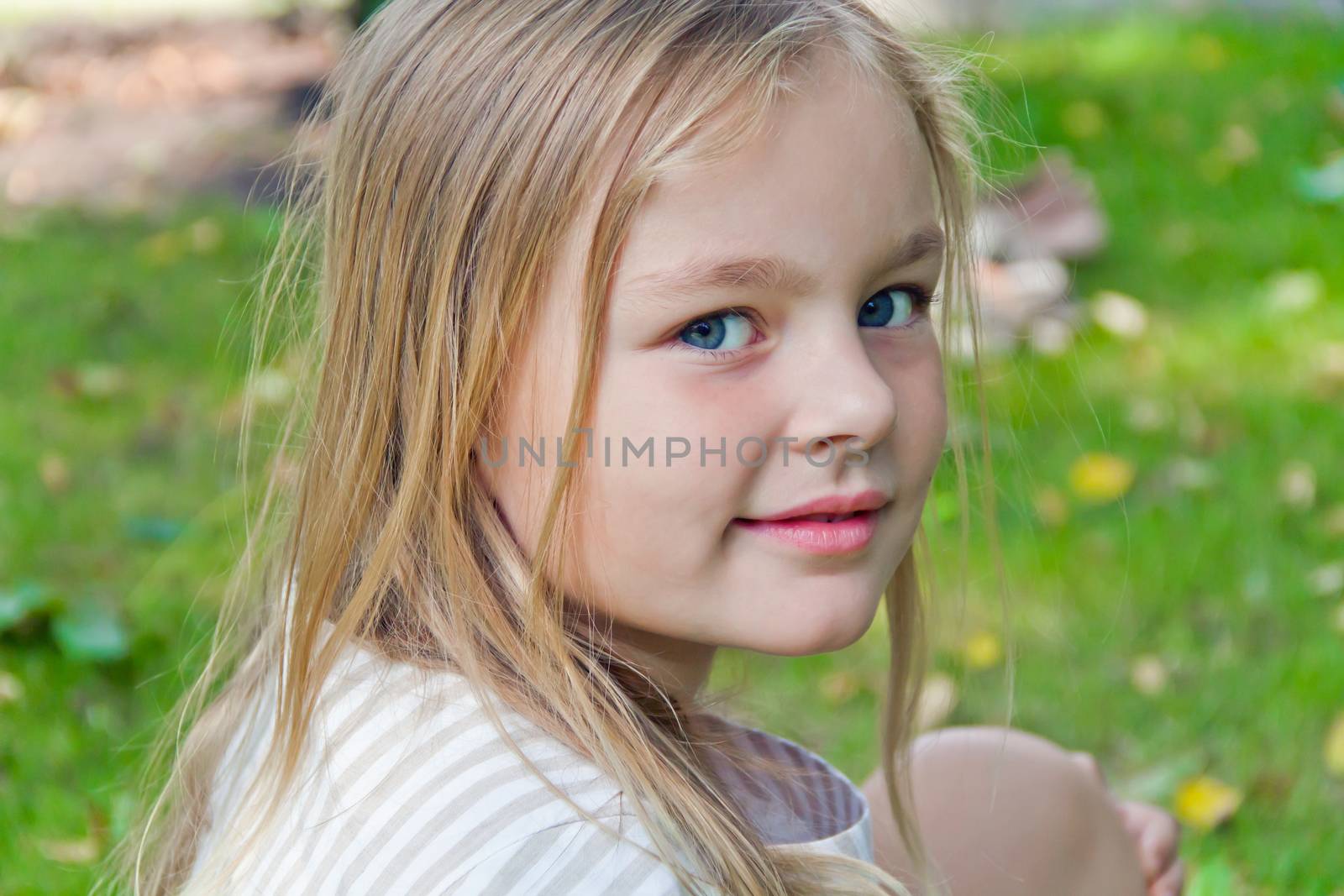 Photo of cute girl with big blue eyes