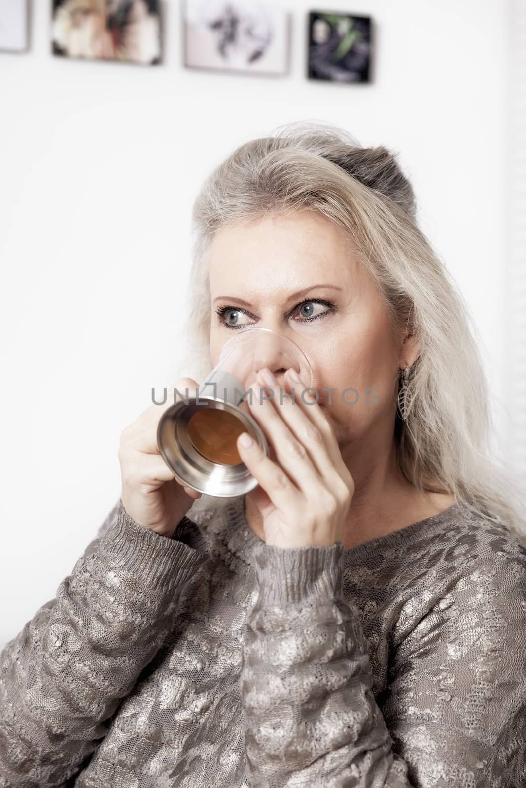 An image of a best age woman with a cup of tea