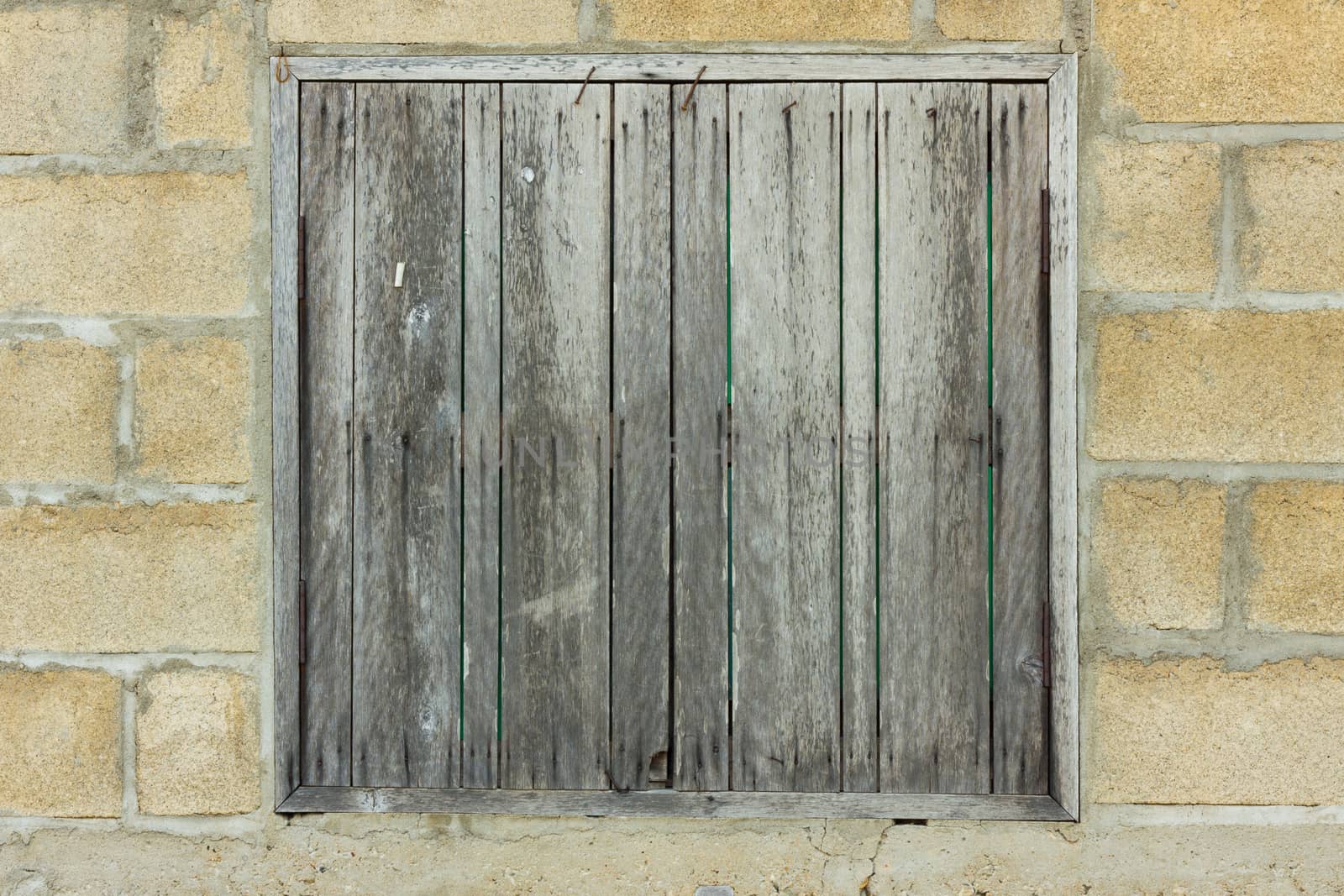 wooden window is very old located in Northern of Thailand