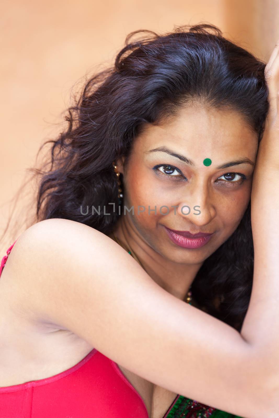 smiling indian woman in a saree by bernjuer