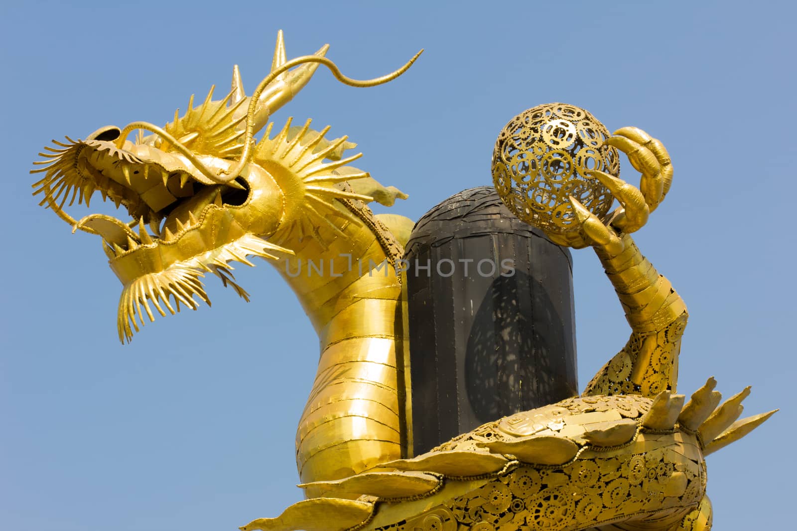 Giant golden Chinese dragon on blue sky