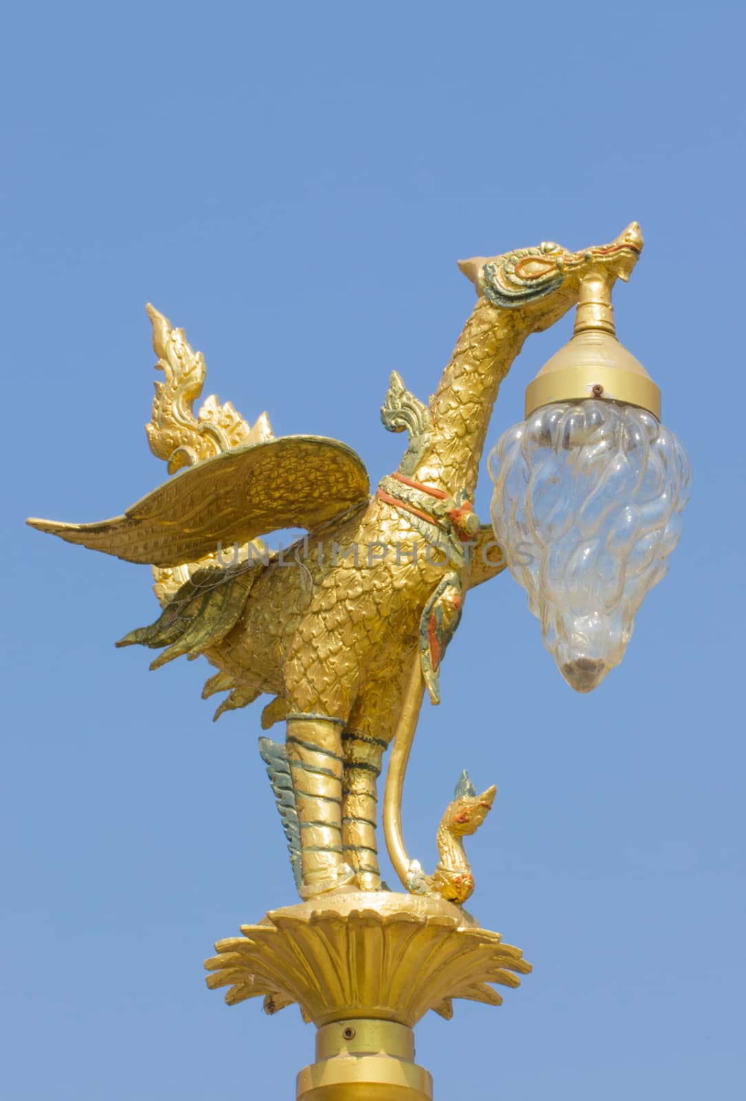 Golden swan lamp on street in Thai Style in blue sky background