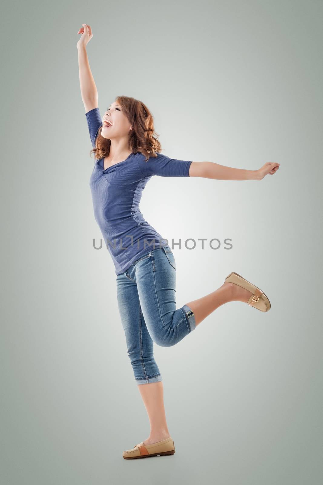 Excited Asian young girl, full length portrait isolated.