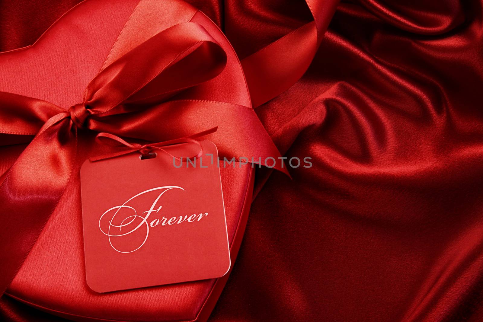 Chocolate box with gift card on satin background by Sandralise