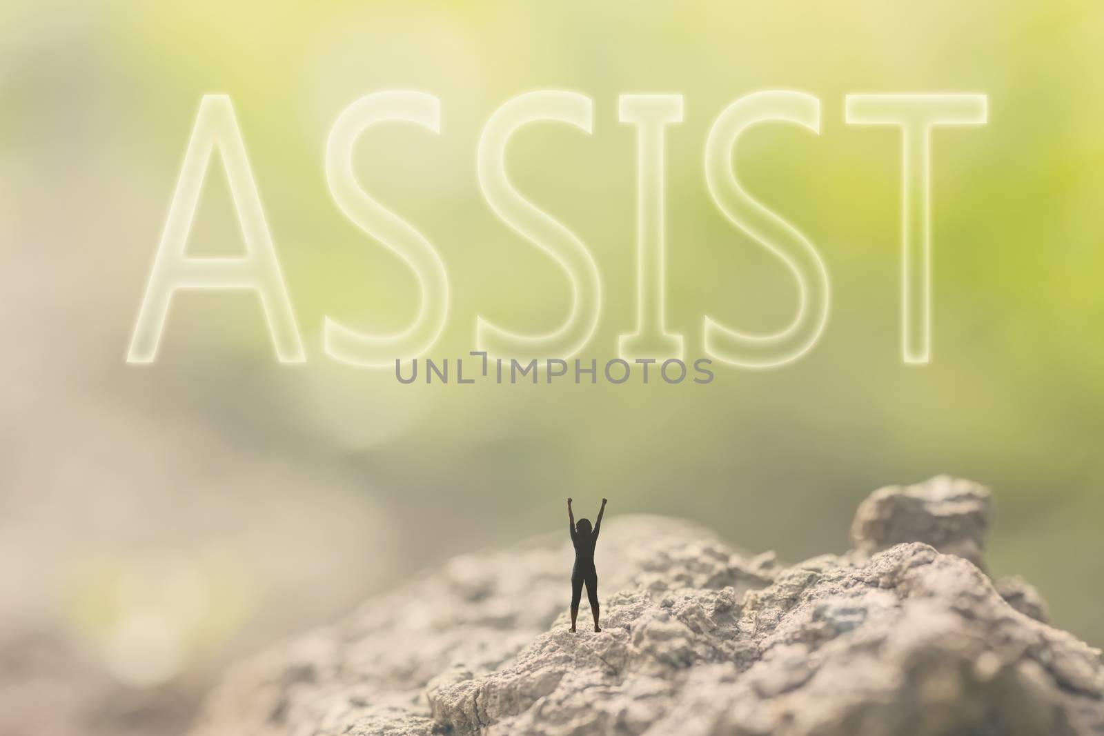 Concept of assist with a person stand in the outdoor and looking up the text over the sky in nature background.
