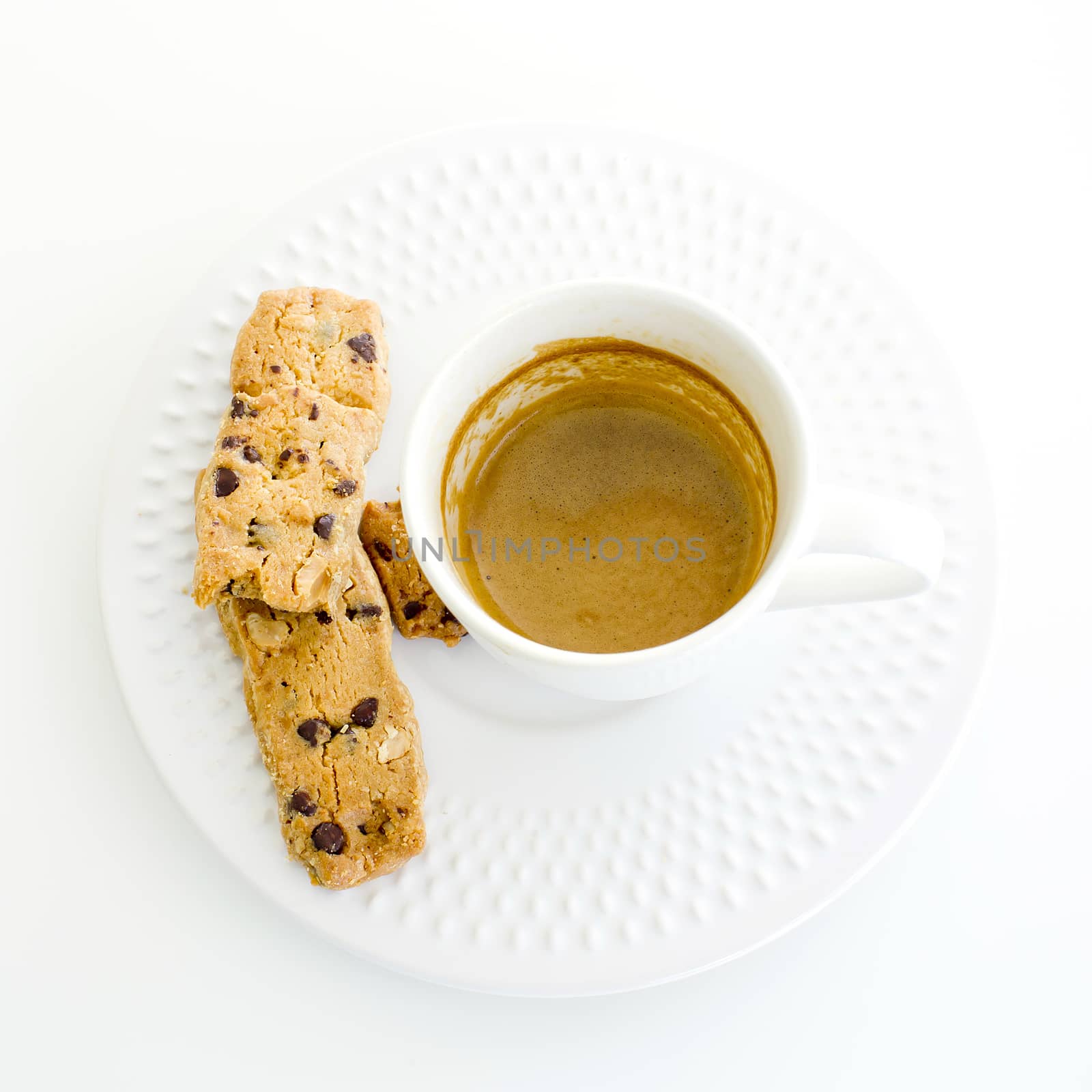 a cup of white coffee and chocolate chip cookies over a wooden t by art9858