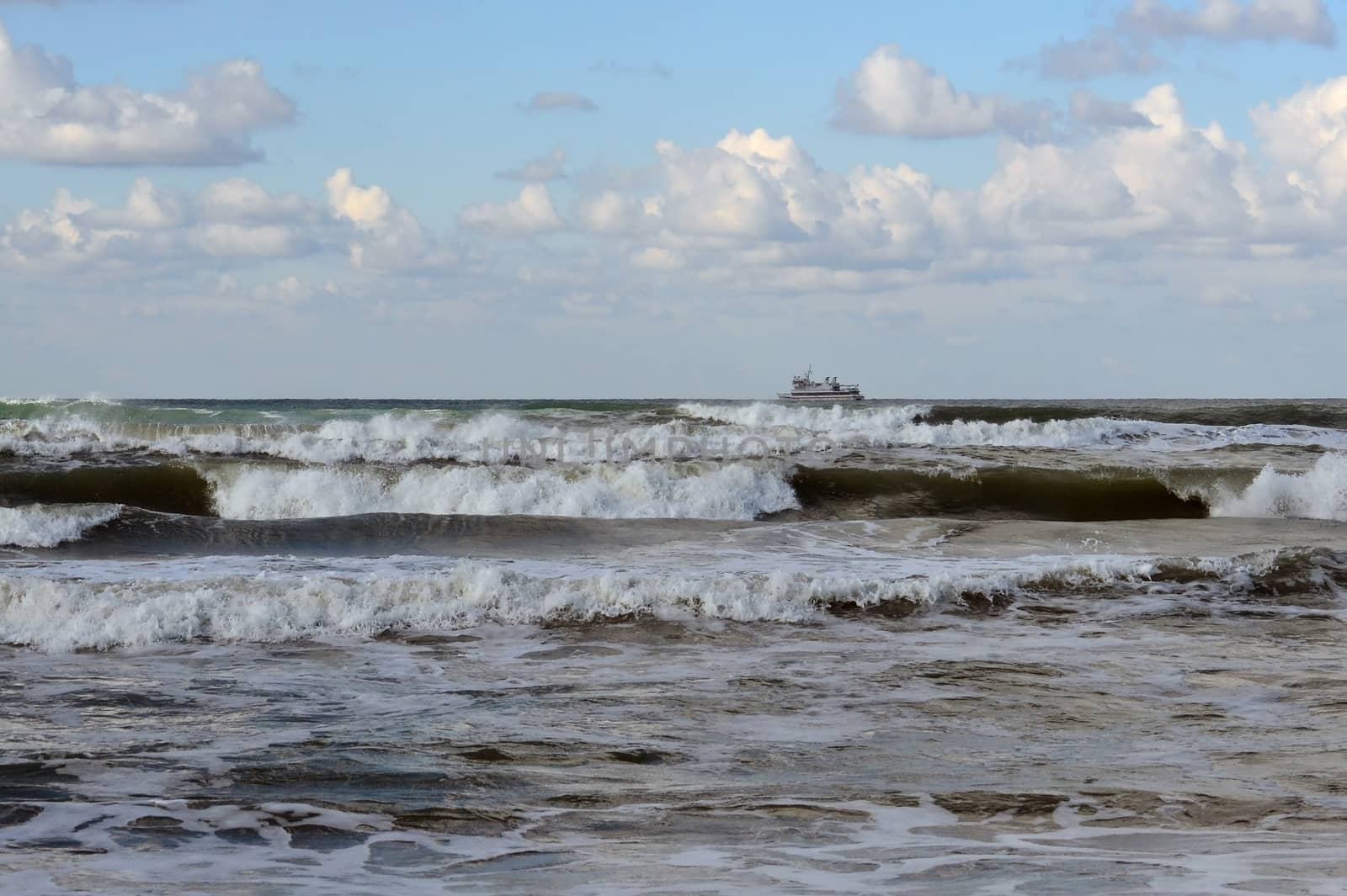 Waves of the Black Sea, Anapa, Krasnodar Krai. The ship in the sea on the horizon