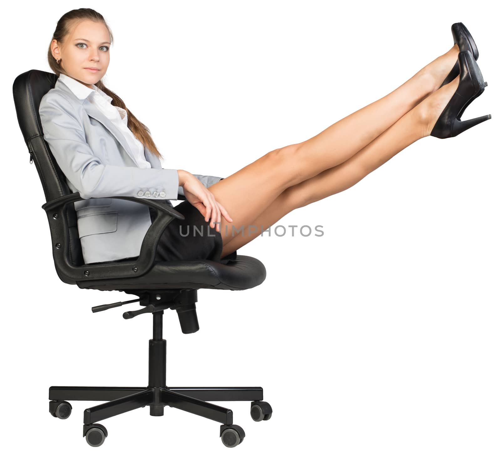 Businesswoman on office chair with her feet up by cherezoff