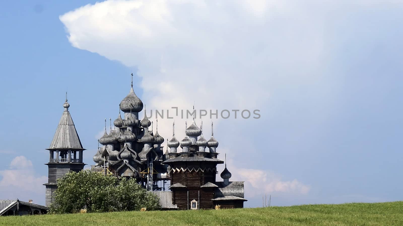 Old Russian wooden Church, the Church in the field, a wonderful rustic look, the background. by mcherevan