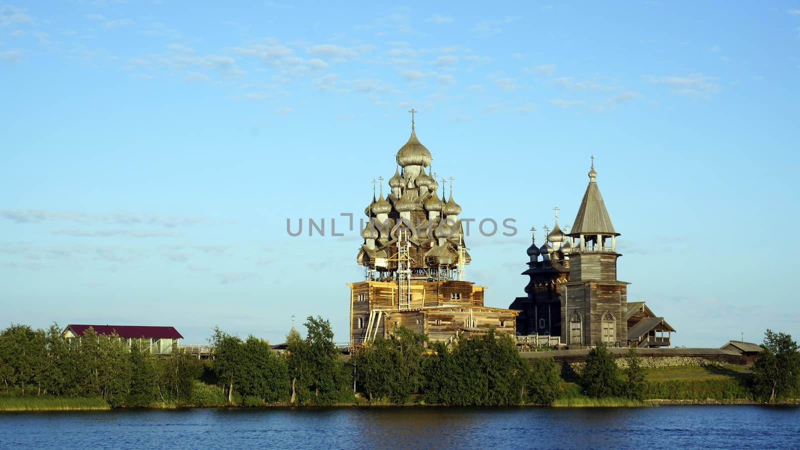 Old Russian wooden Church, the Church in the field, a wonderful rustic look, the background. by mcherevan