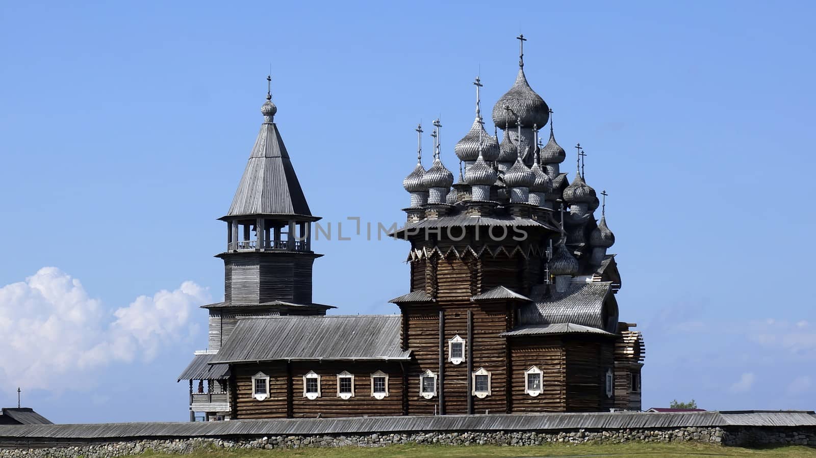 Old Russian wooden Church, the Church in the field, a wonderful rustic look, the background. by mcherevan