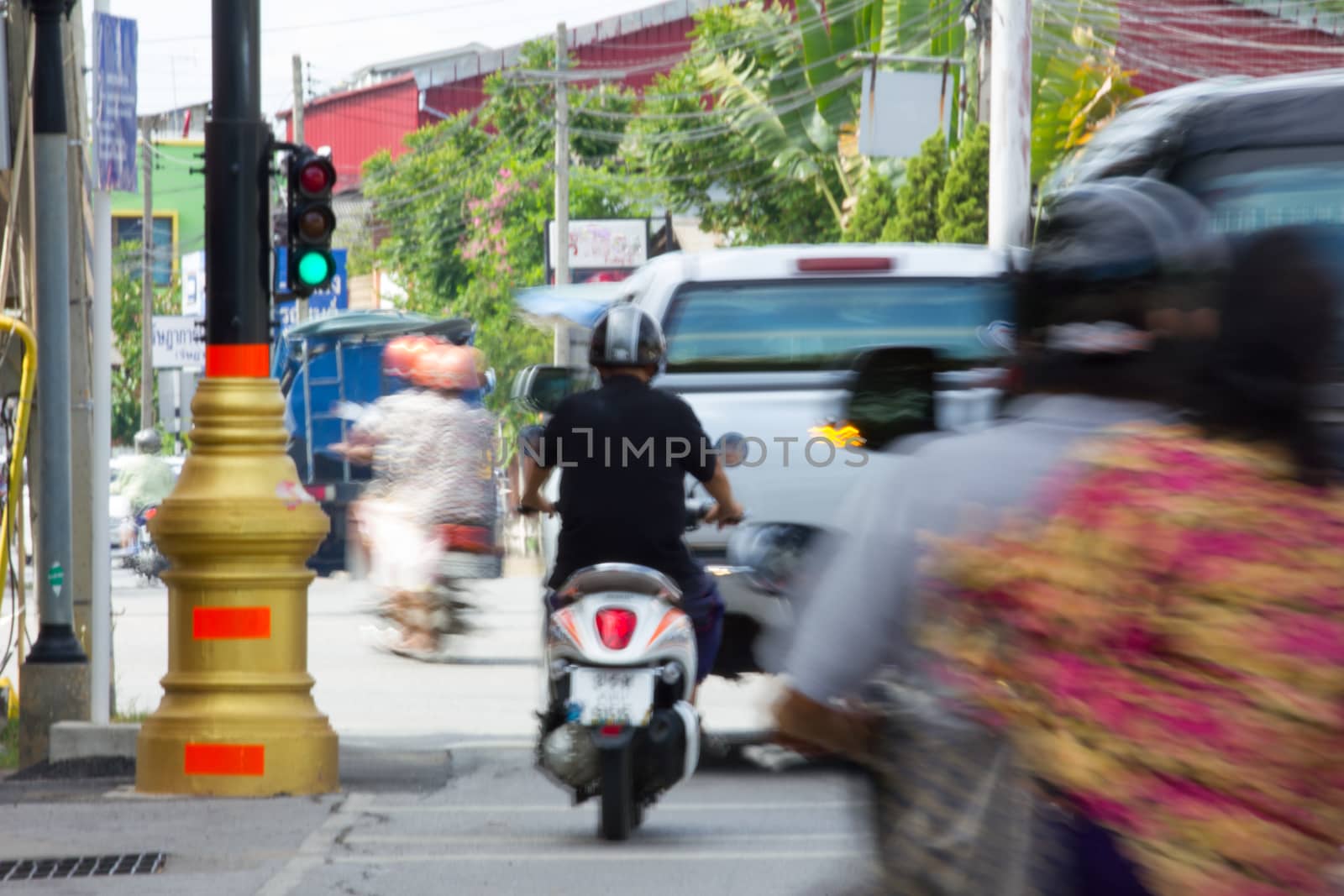 Blurred image of vehicles running on street in Thailand (motion blur image)