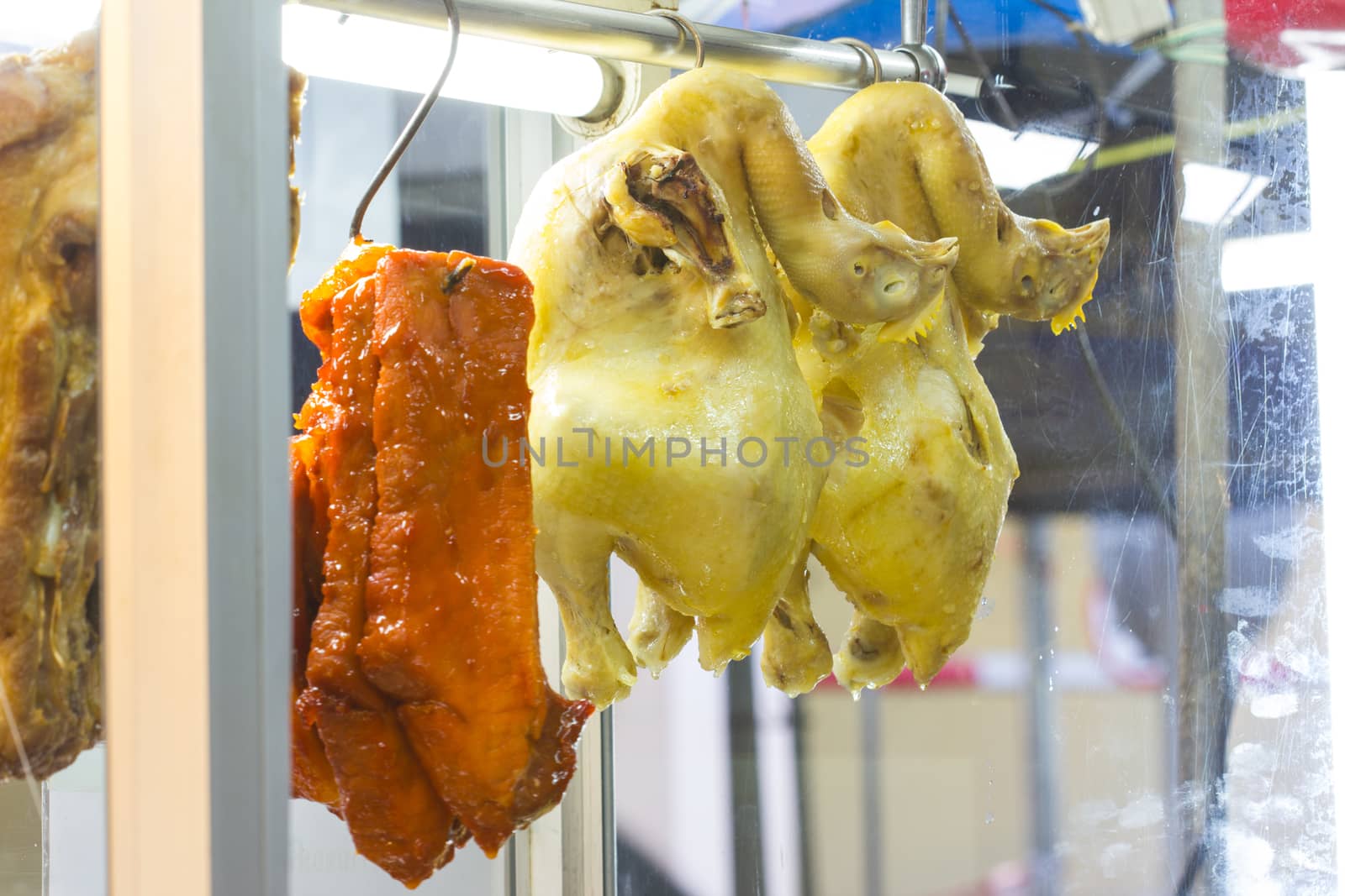 Boiled chickens and cooked red pork - Popular Thailand food