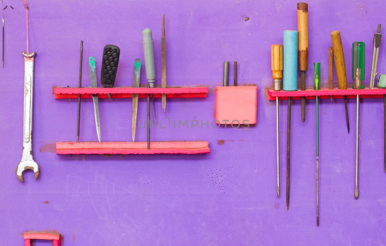 Mechanic tools set isolated on purple wall by a3701027