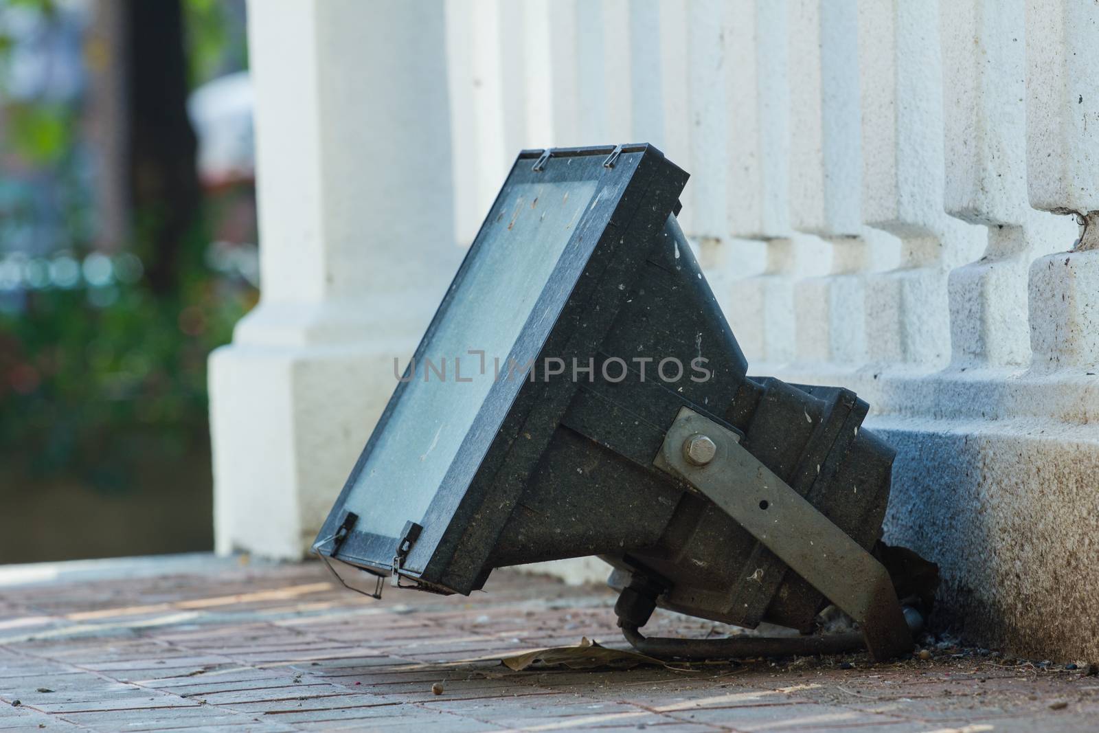 old metal outdoor spotlight in a temple in Thailand by a3701027