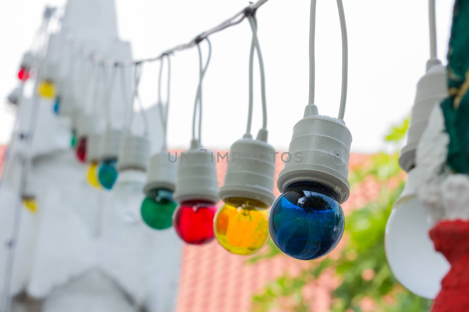colorful light bulbs in daylight by a3701027