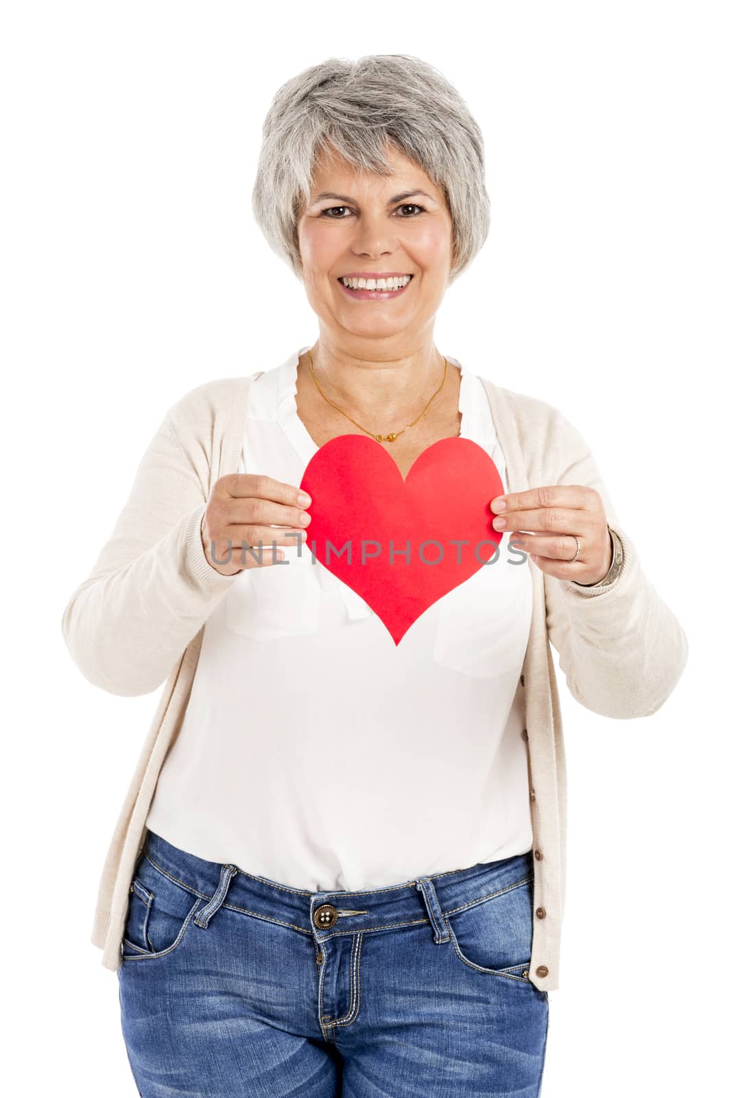 Elderly woman holding a heart shape in her hands, isolated on white background