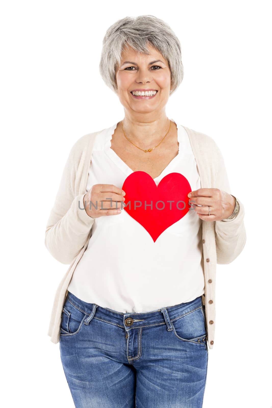 Elderly woman holding a heart shape in her hands, isolated on white background