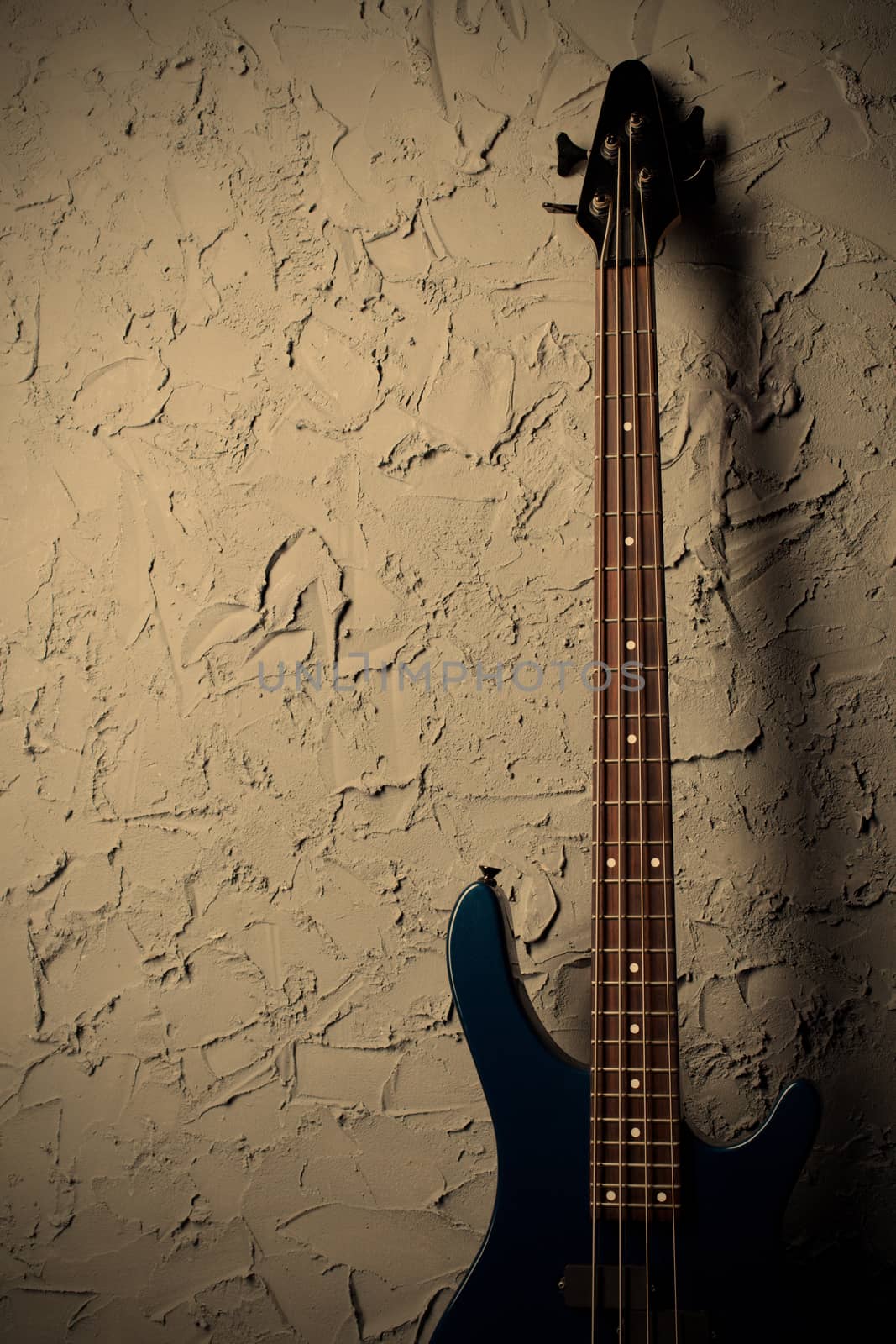 guitar stands near the gray wall, instagram image style