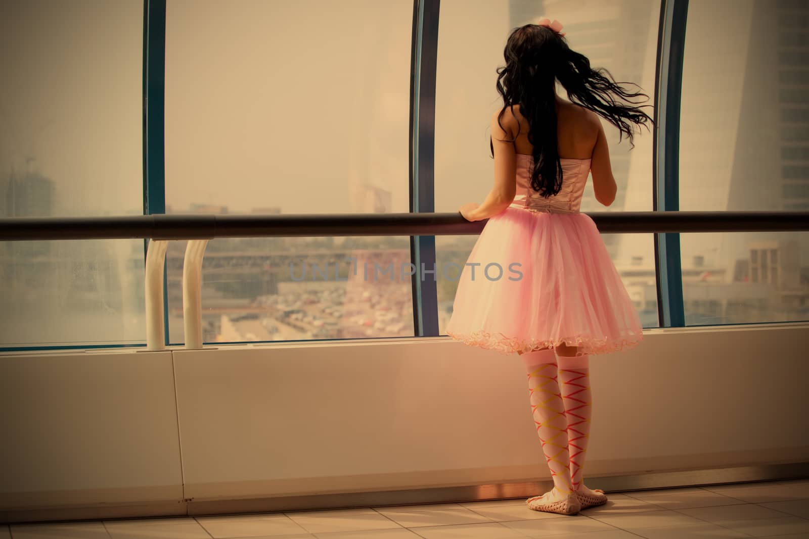 girl doll stands at the window glass gallery back to the camera, instagram image style