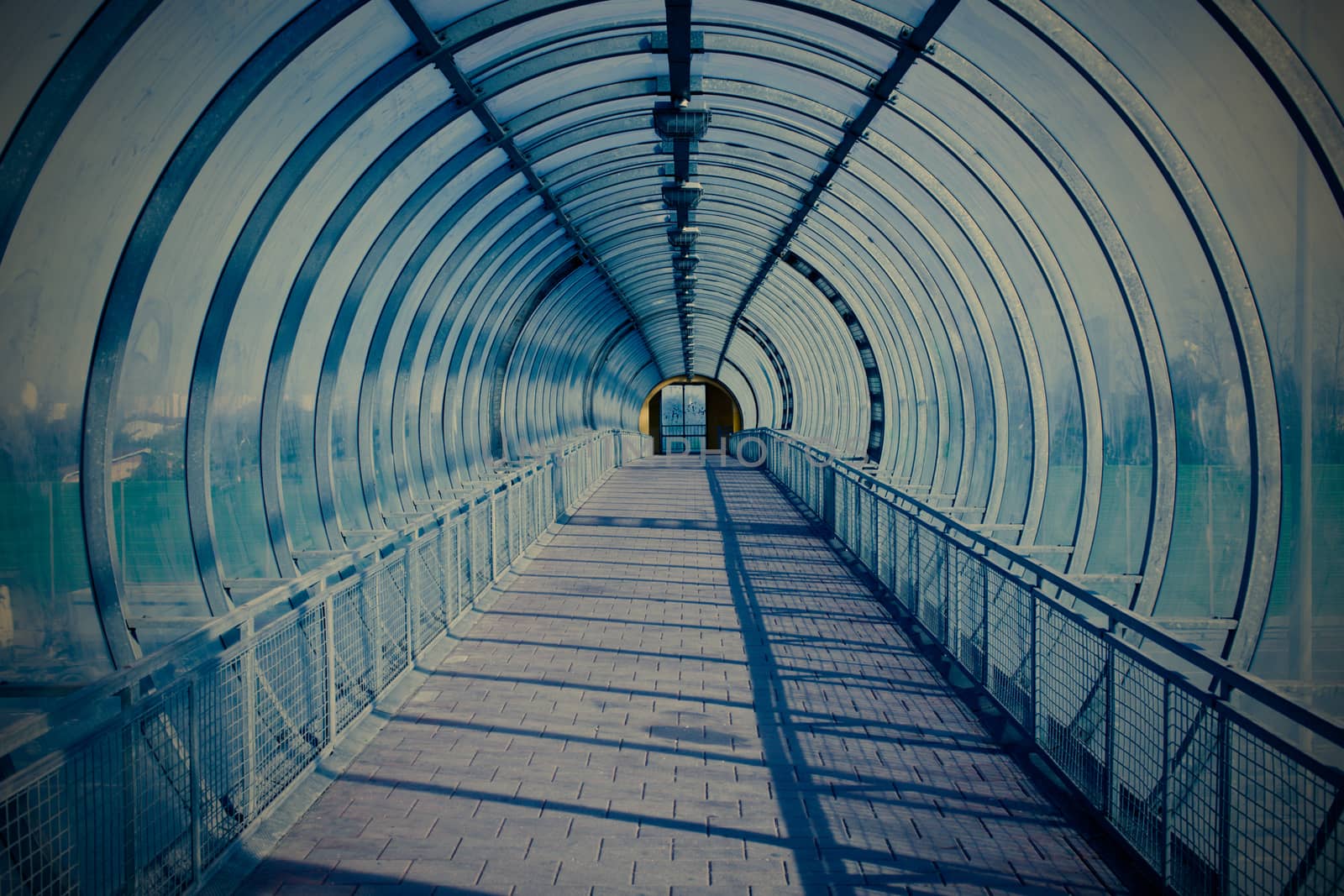 Blue modern tunnel for pedestrians above the highway, instagram image style