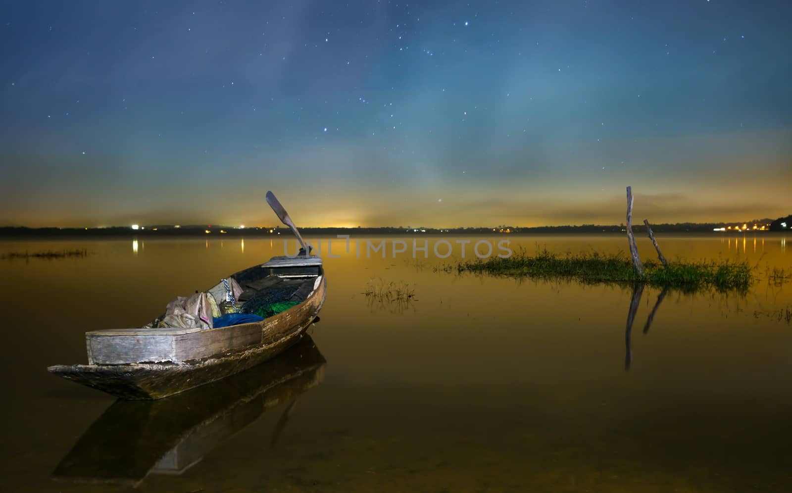 Fishing boat and Sky of night Bang Pra Reservoir, Chonburi, Thailand.