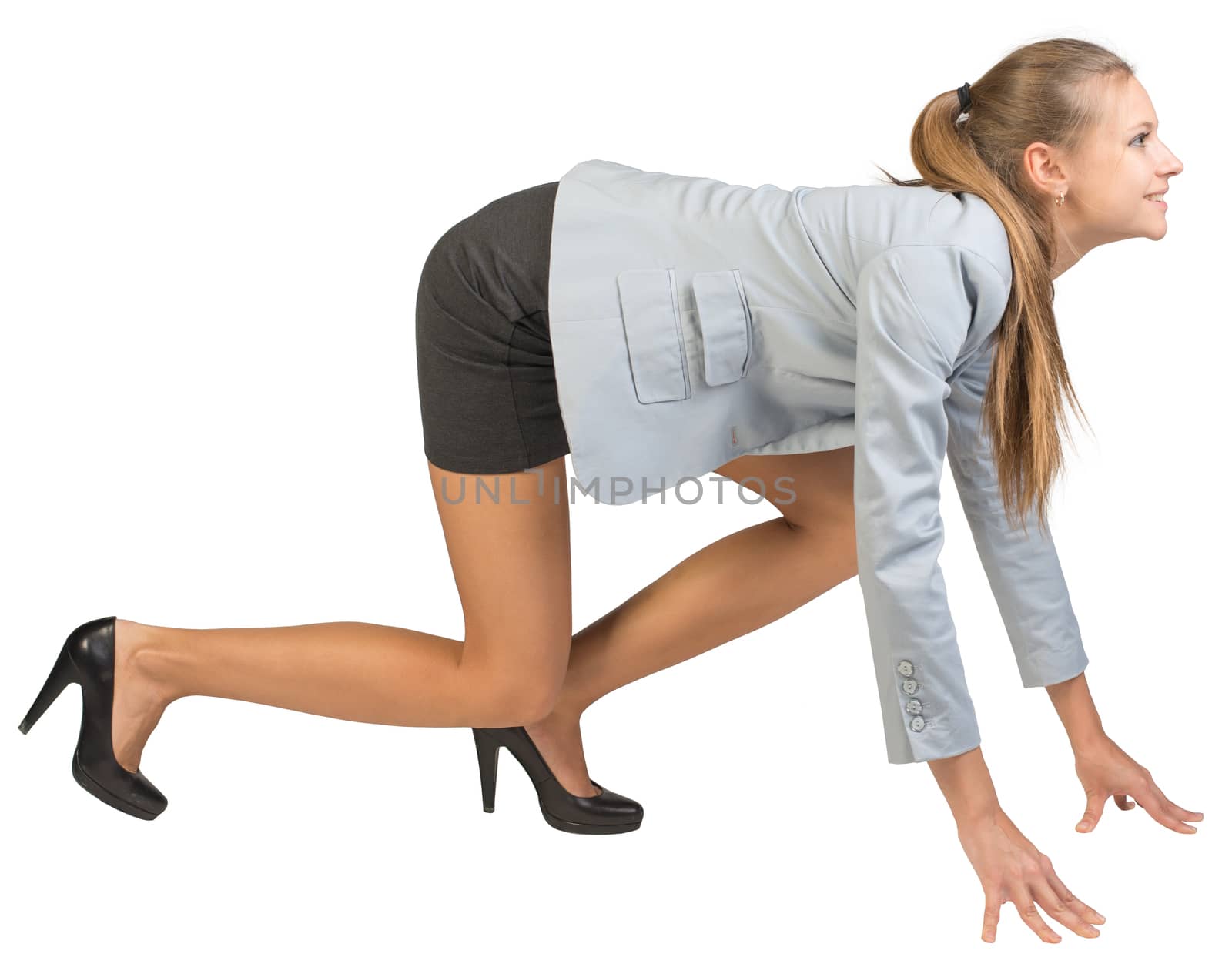 Businesswoman standing in running start pose, smiling, side view. Isolated over white background