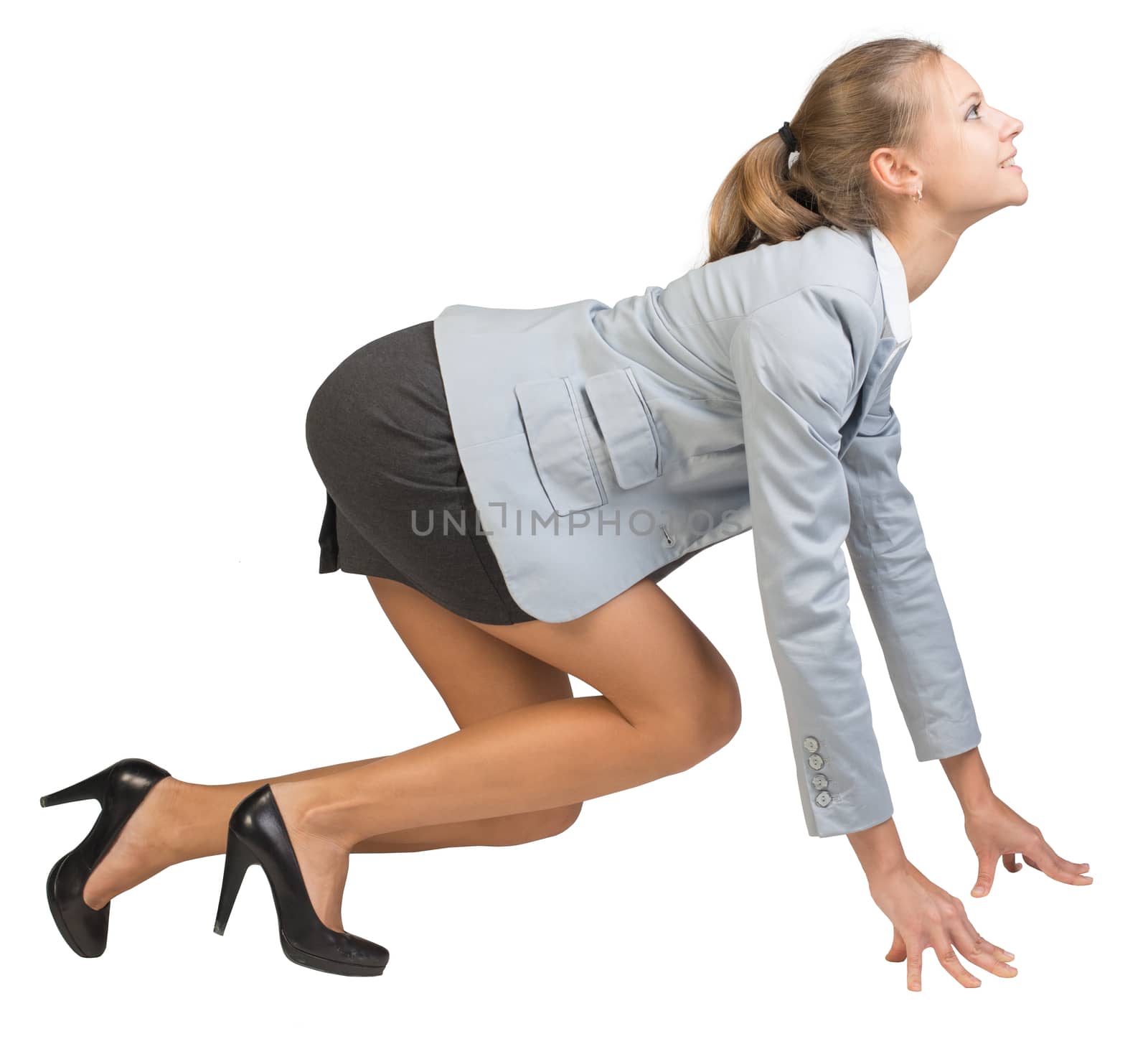 Businesswoman standing in running start pose, smiling, side view. Isolated over white background