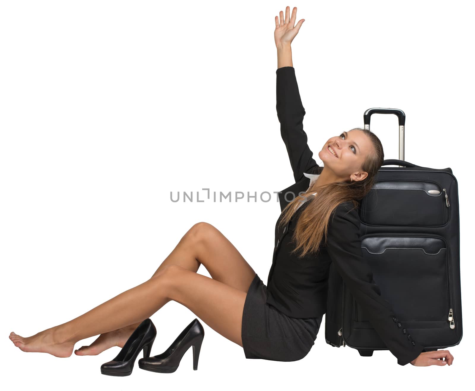 Businesswoman with her shoes off sitting next to front view suitcase by cherezoff