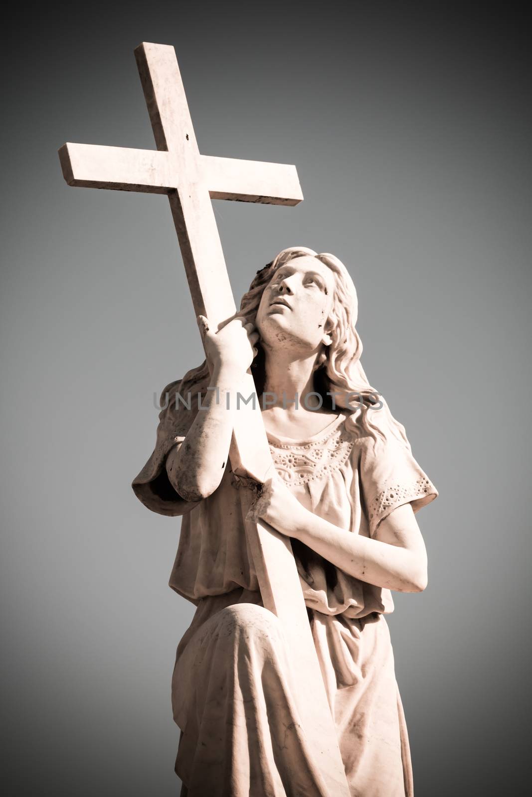 Statue of woman with cross by bolkan73