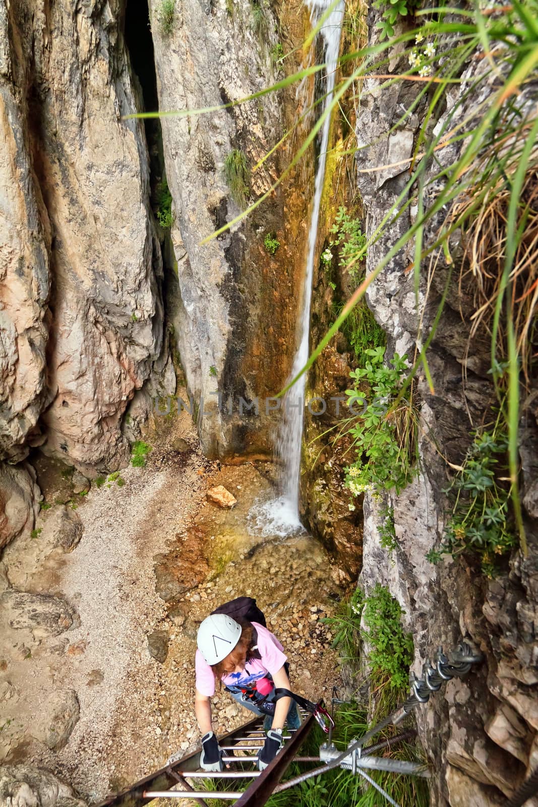 climber on Giovannelli gorge via ferrata Trentino, Italy