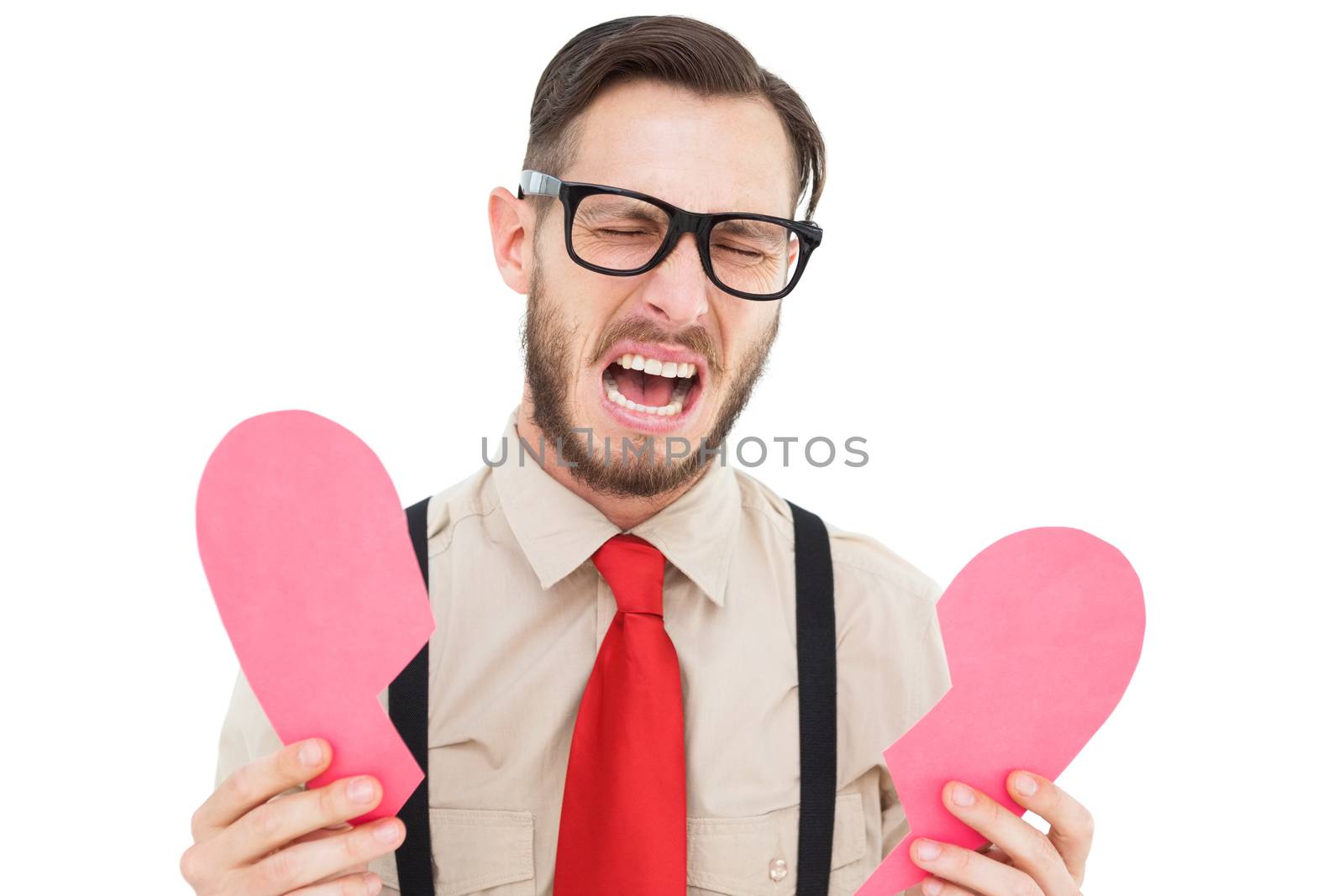 Geeky hipster crying and holding broken heart card on white background