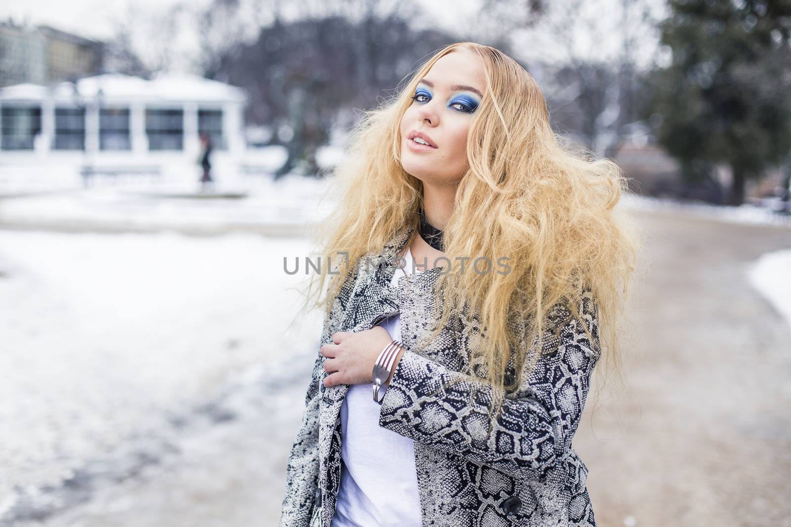 Woman in a faux snake leather jacket in the winter