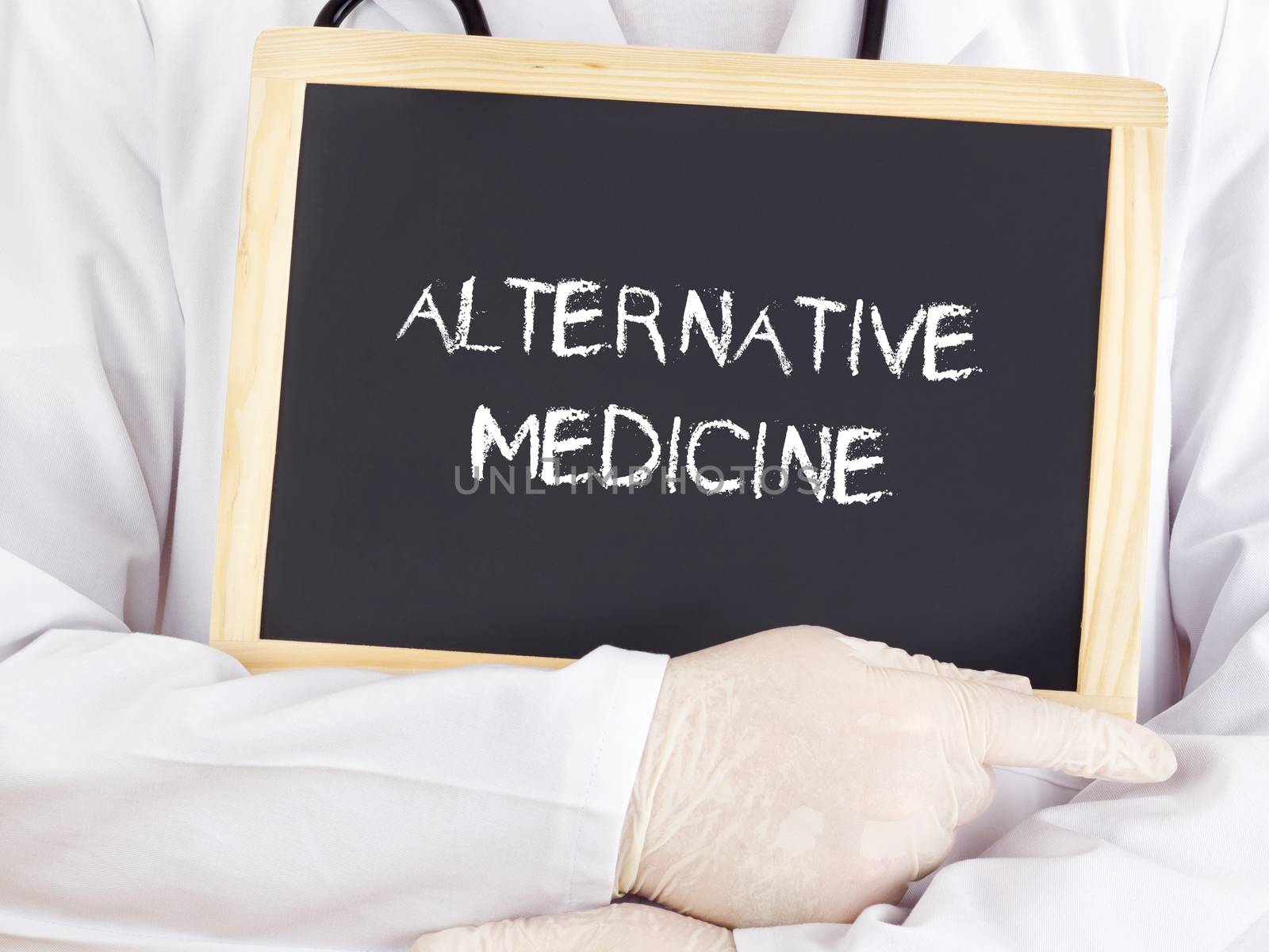 Doctor shows information on blackboard: alternative medicine