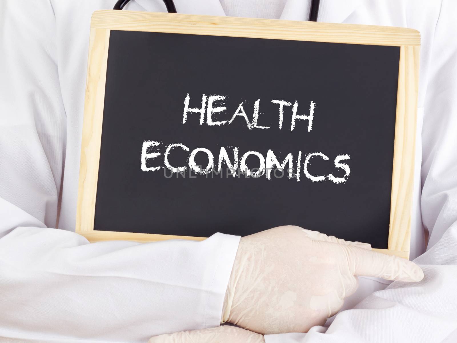 Doctor shows information on blackboard: health economics