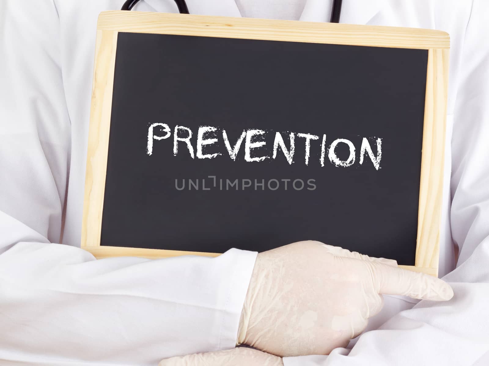 Doctor shows information on blackboard: prevention by gwolters