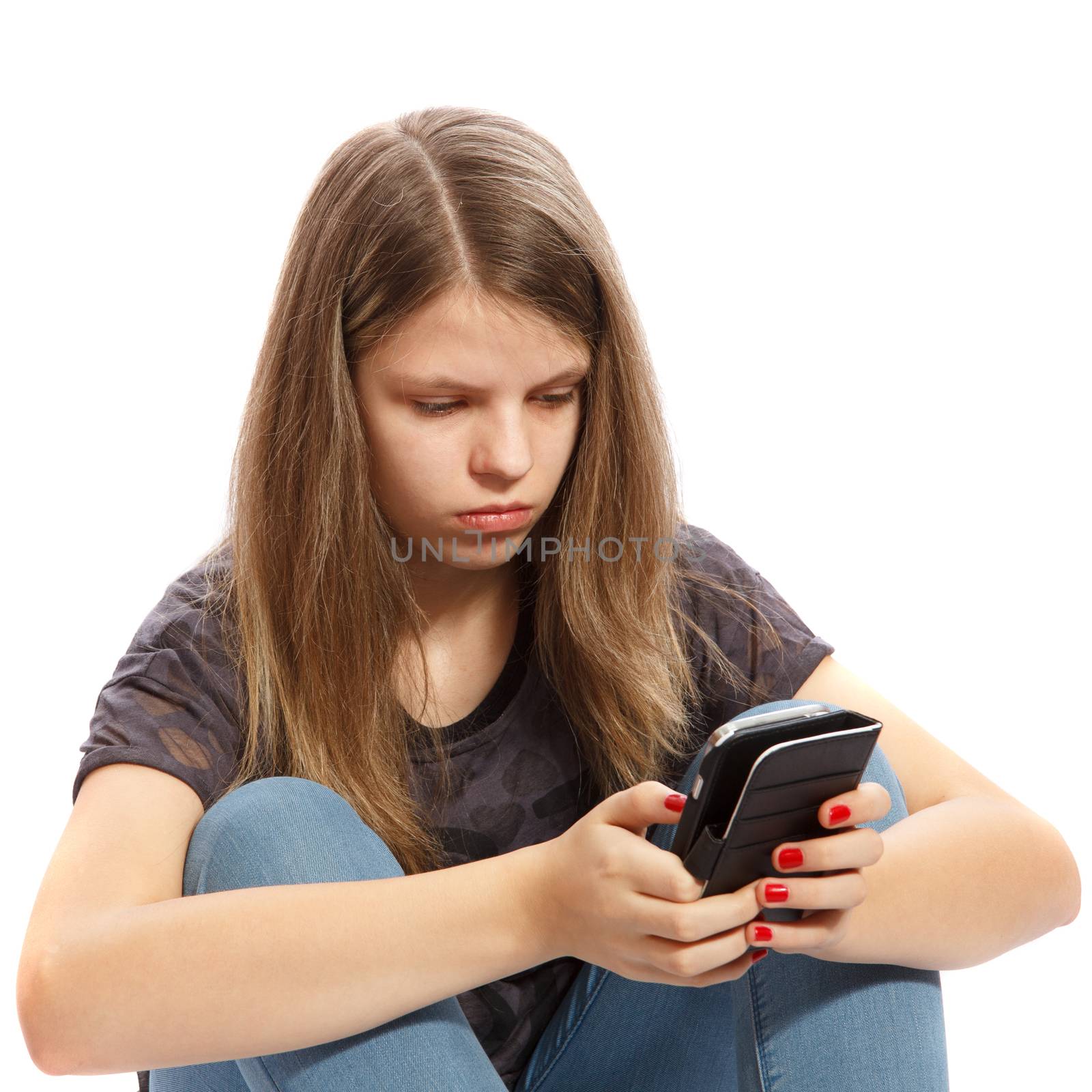 A teenage girl working with her smartphone