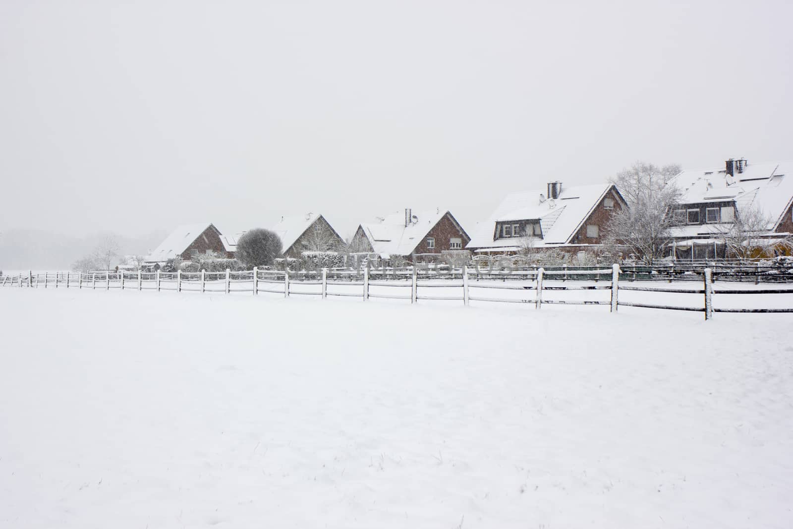 snowfall in the village - winter landscape by miradrozdowski