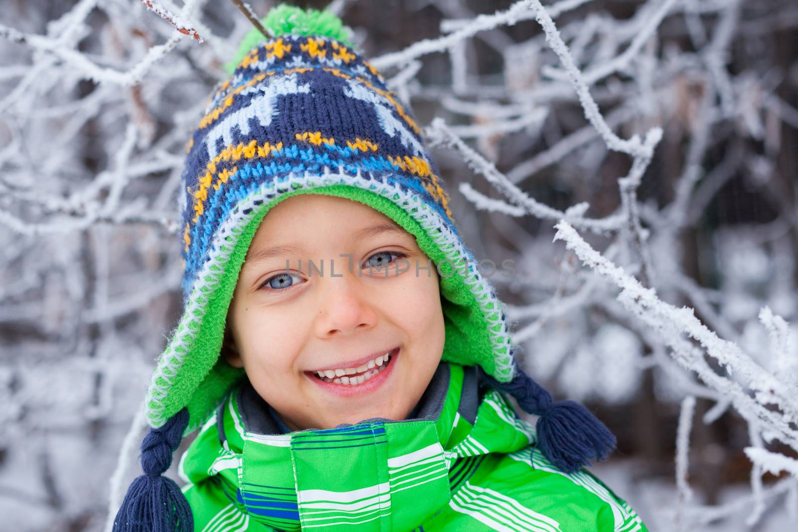 Portrait of a little boy in the snow